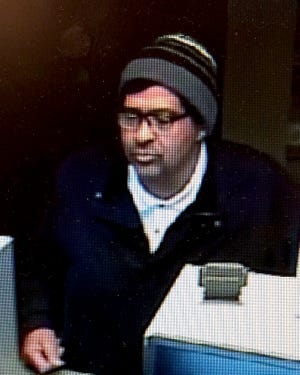 Columbia police released this surveillance photo of a man suspected in a robbery Friday at Central Bank on Nifong Boulevard. [Contributed]