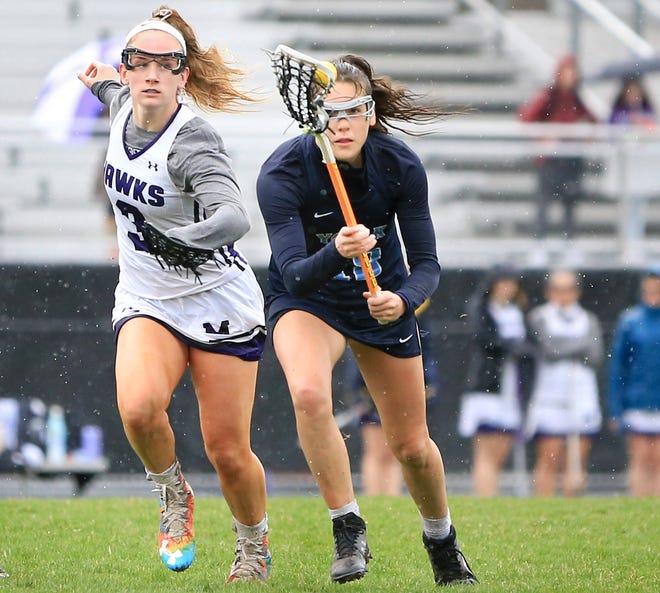 York High School's Cassie Reinertson, right, steals the ball from Marshwood's Celine Lawrence during Friday's game in South Berwick, Maine. Reinertson scored four goals in York's 12-8 win.
[Ioanna Raptis/Seacoastonline]