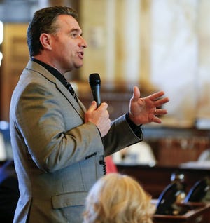 Sen. Ty Masterson, R-Andover, questions Sen. Bruce Givens, R-El Dorado, about a bill Friday afternoon that would lower the state's share of gambling revenue at dog and horse racetracks. [Chris Neal/The Capital-Journal]