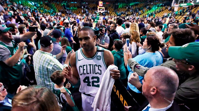 Al Horford wades through the crowd after Boston's Game 7 win.