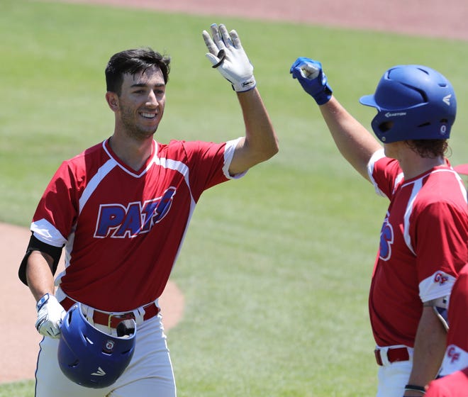 The College of Central Florida's Ricky Presno, left, celebrates his third-inning home run against Lake Sumter State College in Ocala on Saturday. Presno also homered on Sunday as the Patriots defeated the LakeHawks 11-1 in Leesburg to clinch the best-of-three MFC conference series. With the win, the Patriots will now advance to the state tournament in Lakeland. CF will face Southern Conference No. 1 Broward College on Friday, May 11 at 1 p.m. at Joker Marchant Stadium in Lakeland. [Bruce Ackerman/Staff photographer/File]