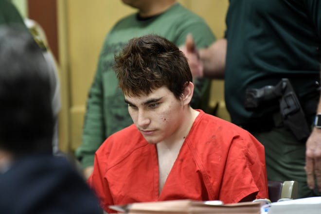 Florida school shooting suspect Nikolas Cruz, glances down while in court for a hearing in Fort Lauderdale on Friday. [TAIMY ALVAREZ/SOUTH FLORIDA SUN-SENTINEL]