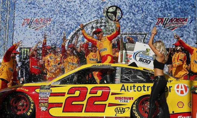 NASCAR driver Joey Logano celebrates in victory lane after winning the NASCAR Talladega auto race at Talladega Superspeedway, Sunday, April 29, 2018. [AP Photo/Brynn Anderson]