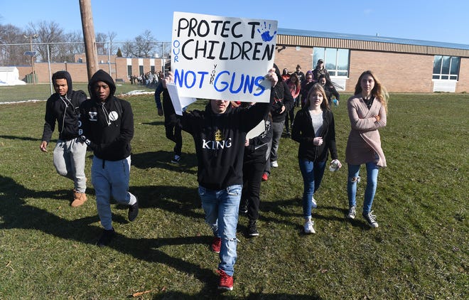 Students at Maple Shade High School participate in a walkout in Maple Shade in March. Students honored victims of the recent shooting at Marjory Stoneman Douglas High School in Parkland, Florida. [CARL KOSOLA / STAFF PHOTOJOURNALIST]