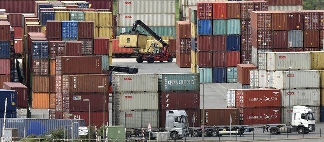 Containers are stored for export at a harbor in Duisburg, Germany, Monday, April 30, 2018. (AP Photo/Martin Meissner)