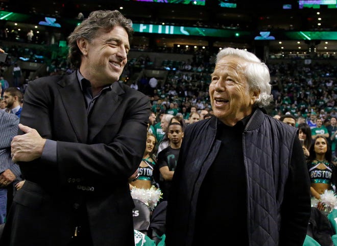 Celtics owner Wyc Grousbeck, left, chats with New England Patriots owner Robert Kraft before Game 1 on Monday night.