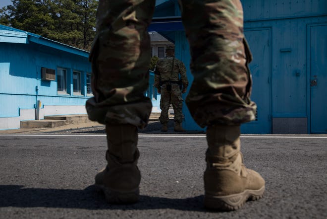 U.S. soldiers stand guard next to the United Nations Command Military Armistice Commission (UNCMAC) conference buildings at the truce village of Panmunjom in the Demilitarized Zone (DMZ) in Paju, South Korea, on April 18, 2018. MUST CREDIT: Bloomberg photo by SeongJoon Cho