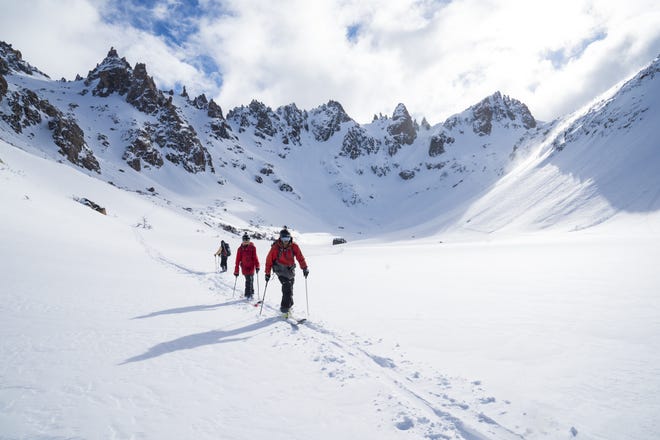 Students with the National Center for Outdoor and Adventure Education ski through the mountains of Chile. UNCW students can now take wilderness courses through the organization in Chile, Patagonia and Alaska. [CONTRIBUTED PHOTO]