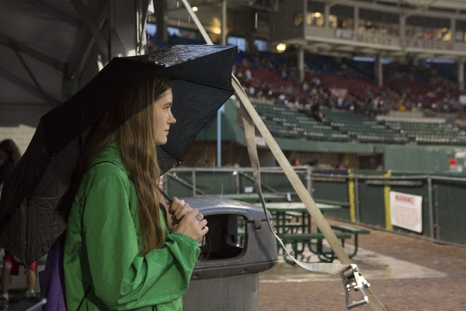 Meghan Sheehan of MIllville looks out to the field at McCoy Stadium during a rain delay at the park last year. [File Photo/Matt Wright]