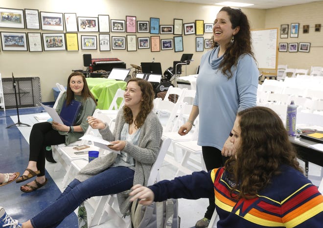 Students at Tuscaloosa Academy are working with the University of Alabama in a new therapeutic theater program designed to help people with autism spectrum disorder. Theater teacher Sara-Margaret Cates, standing, works with theater students Madeleine Crow, Ella Huffaker and Holly Dunn on Thursday, April 26, 2018. [Gary Cosby Jr./Staff Photo]