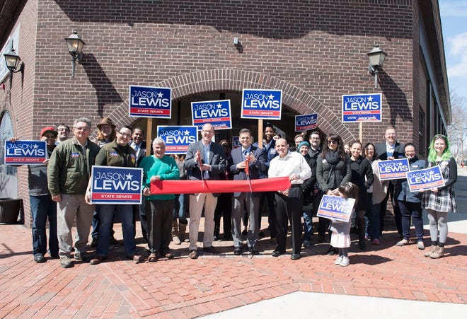 State Sen. Jason Lewis is joined by Malden Mayor Gary Christenson, State Rep. Steven Ultrino, D-Malden, State Rep. Paul Donato, D-Medford, other local elected officials and supporters from around the Fifth Middlesex District to celebrate volunteers and open the new campaign HQ in Malden. [Courtesy Photo]