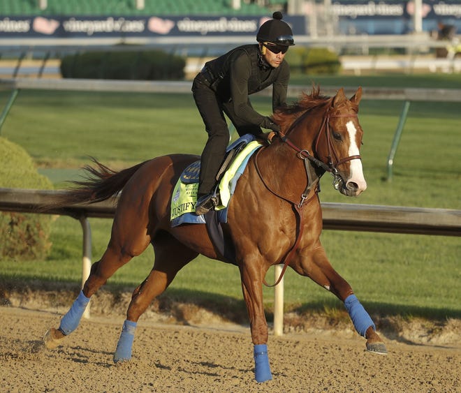 Kentucky Derby hopeful Justify runs during a morning workout at Churchill Downs Tuesday in Louisville, Ky. The 144th running of the Kentucky Derby is Saturday. [Charlie Riedel/AP]