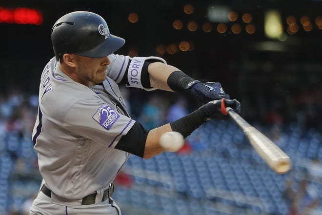Colorado Rockies' Trevor Story strikes out swinging during his at-bat against the Washington Nationals during the first inning of a baseball game on April 12 at Nationals Park in Washington. There were more strikeouts than hits in the first month of the season, when home runs dipped from last year's record during a cold and wet April. [AP Photo/Pablo Martinez Monsivais]