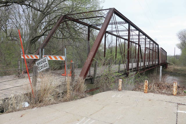 The Adel Bridge on River Road in Adel has been closed since 2000. The bridge could be a factor in a possible vacation of 288th Trail on the other side of the Raccoon River. PHOTO BY CLINT COLE/DALLAS COUNTY NEWS