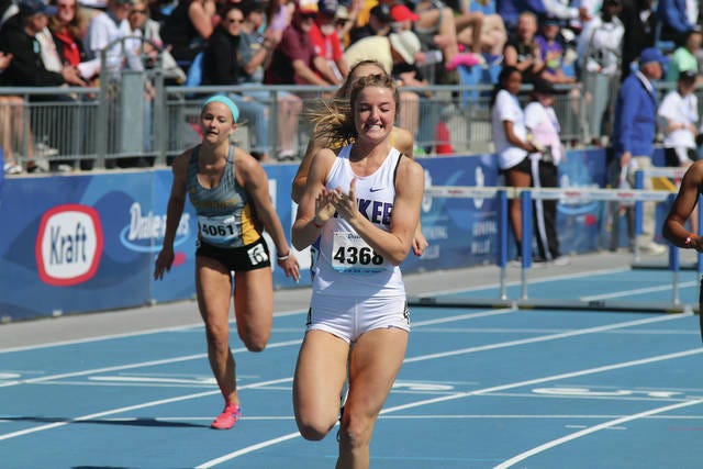Waukee’s Sydney Winger celebrating after winning the girls’ 100 meter hurdles at the Drake Relays. Her time of 14.19 seconds broke the previous Drake Relays record. PHOTO BY ANDREW BROWN/DALLAS COUNTY NEWS
