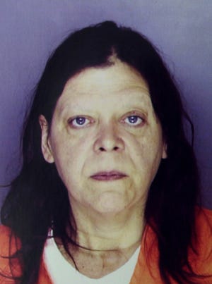Erie police released this photo of Marjorie Diehl-Armstrong in 2003, after her arrest in the fatal shooting of her boyfriend James Roden, whose body was found in a freezer. Diehl-Armstrong died in a federal prison in Texas on Tuesday.