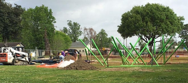 Work has begun on improvements to the North Plaquemine Park and Herman Graham Park off W.W. Harleaux Street. EACH park will get $100,000 of playground equipment, re-surfaced basketball courts (courtesy of IPRD), restrooms, landscaping improvements and parking. In the photo, installation of the playground equipment has begun. All the improvements are expected to be completed by the end of May. (Photo courtesy of the City of Plaquemine)