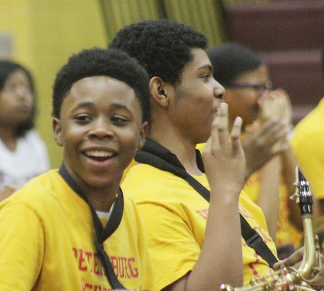 Saxophone player Xavier McMullen smiles during the Petersburg High School Marching Band's fundraiser showcase on April 28, 2018. [John Adam/progress-index.com]