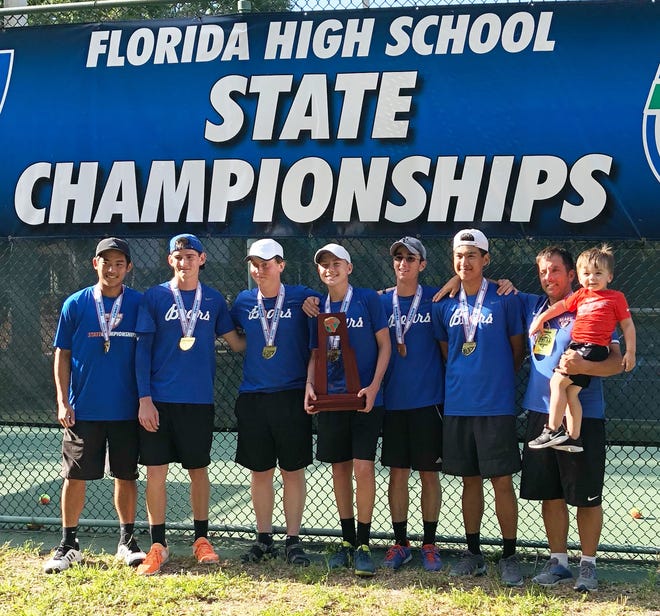 Bartram Trail won the Class 3A state boys tennis championship Tuesday in Casselberry. From left, Brandon Pham, Cole Ginter, Michael Guyot, Sam Sirotkin, Daniel Welch, Brian Pham and coach Scott Miller with son Graham. [Contributed]