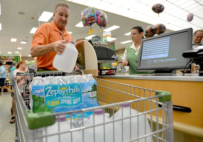 Bart Mayham stocks up on bottled water in preparation for Hurricane Matthew at Publix in the Shoppes Of Lake Village plaza on Oct. 5, 2016, in Leesburg. [Daily Commercial file]