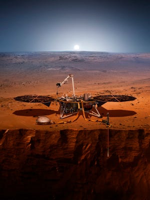 This illustration made available by NASA in 2018 shows the InSight lander drilling into Mars. InSight, short for Interior Exploration using Seismic Investigations, Geodesy and Heat Transport, is scheduled to launch from Vandenberg Air Force Base on Saturday, May 5, 2018, and land on Mars six months later. (NASA via AP)