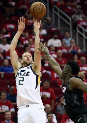 Utah Jazz forward Joe Ingles (2) shoots as Houston Rockets center Clint Capela defends during the second half in Game 2 of an NBA basketball second-round playoff series Wednesday, May 2, 2018, in Houston. (AP Photo/Eric Christian Smith)