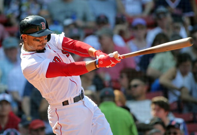 Boston Red Sox's Mookie Betts hits his third home run of the game in the seventh inning in a baseball game against the Kansas City Royals, at Fenway Park, Wednesday, May 2, 2018, in Boston. (AP Photo/Elise Amendola)