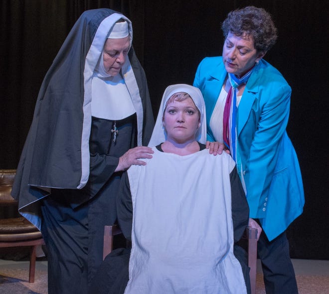 Mother Superior Miriam Ruth, left, (Nancy Howell) and psychiatrist Martha Livingston (Julia Truilo) right, comfort Sister Agnews (Chelsea Jo Conard) in "Agnes of God." [Photos provided/Mike Kitaif]