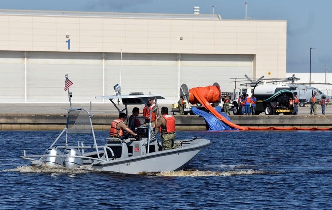Crews from the Boat House Division were used to deploy the 1,000-foot-long containment boom during the oil spill drill aboard Naval Air Station Jacksonville April 25.