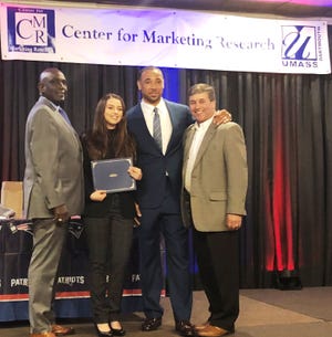 For the third year St. Anne’s sponsored a $1,000 scholarship for an undergraduate marketing student at the University of Massachusetts Dartmouth Center for Marketing Research. From left are Robert E. Johnson, UMass Dartmouth chancellor; UMass Dartmouth student and scholarship recipient Rachel Bellantoni, former Patriot Rodney Harrison and Bernard J. McDonald III, member of St. Anne’s Credit Union Board of Directors. [Submitted photo]
