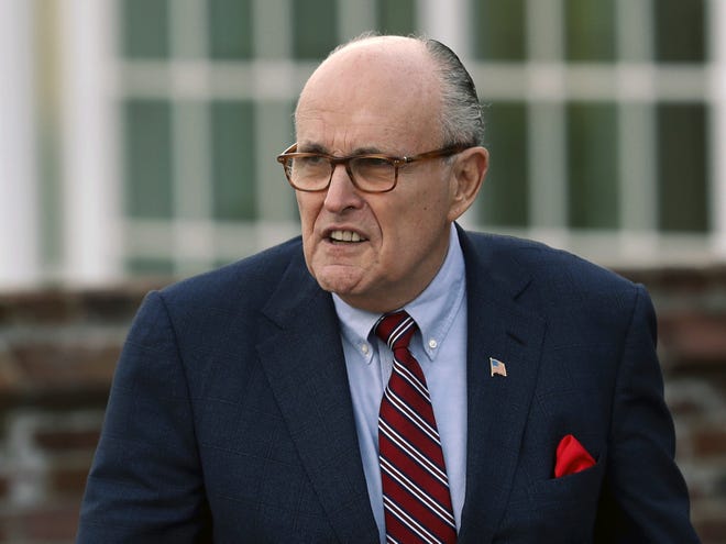 In this Nov. 20, 2016 file photo, former New York Mayor Rudy Giuliani arrives at the Trump National Golf Club Bedminster clubhouse in Bedminster, N.J. President Donald Trump's new lawyer Rudy Giuliani said Wednesday, May 2, 2018, the president repaid attorney Michael Cohen for a $130,000 payment to porn star Stormy Daniels. Giuliani made the revelation during an appearance on Fox News Channel's "Hannity." (AP Photo/Carolyn Kaster, File)