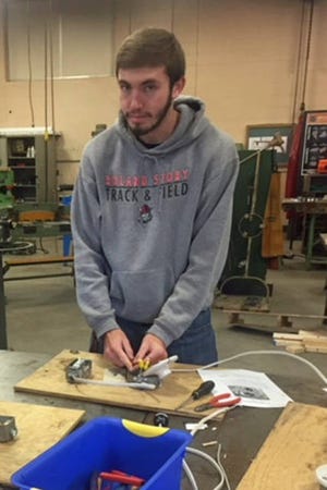 Mitch Shorkey works in the school shop on an electrical wiring activity. Contributed photo