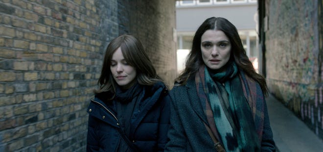 This image shows Rachel McAdams and Rachel Weisz, right, in a scene from "Disobedience." [Bleecker Street]