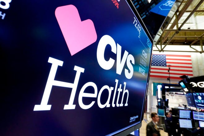 FILE - In this Dec. 4, 2017, file photo, the CVS Health logo appears above a trading post on the floor of the New York Stock Exchange. CVS Health reports earnings Wednesday, May 2, 2018. (AP Photo/Richard Drew, File)