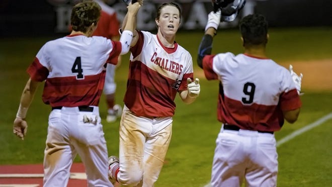 May 2, 2018, Lakeway, TX; Lake Travis Cavaliers Brett Baty (22), center, trots to home plate and is met by Spencer Wionzek (4) and Carlos Contreras (9) after hitting a two-run home run against the San Anronio MacArthur Brahmas in a Class 6A bi-district baseball game at Lake Travis High School. JOHN GUTIERREZ / FOR AMERICAN-STATESMAN