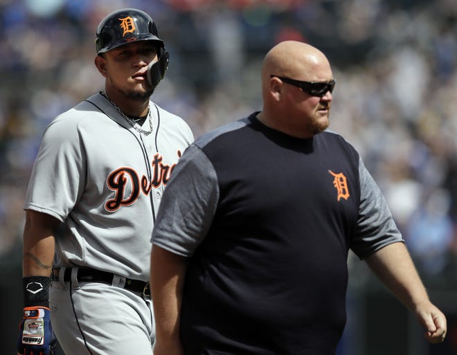Detroit Tigers designated hitter Miguel Cabrera, left, leaves with injury during the sixth inning of a baseball game against the Kansas City Royals at Kauffman Stadium in Kansas City, Mo., Thursday, May 3, 2018. (AP Photo/Orlin Wagner)