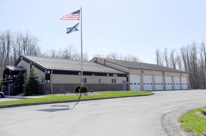 Flags blow out front of the Emergency Services Building in Pocono Pines on Wednesday, May 2, 2018. The building is home to the Tobyhanna Township Volunteer Fire Department. [PATRICK CAMPBELL/POCONO RECORD]
