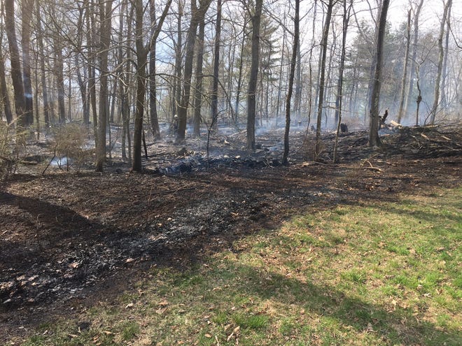 A fire burned more than an acre of woods on this Paradise Township farm Thursday, May 3, 2018. [ANDREW SCOTT/POCONO RECORD]