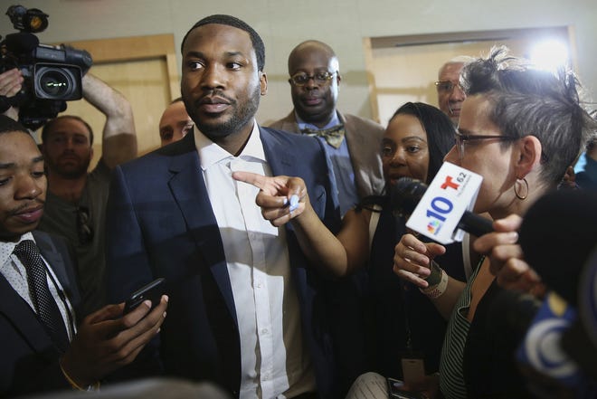 Rapper Meek Mill speaks to media after a news conference promoting Gov. Tom Wolf's proposals to reform the criminal justice system at the National Constitution Center in Philadelphia on Thursday, May 3, 2018. Wolf, Mill and several state legislators spoke in favor of reforms. (Tim Tai/The Philadelphia Inquirer via AP)