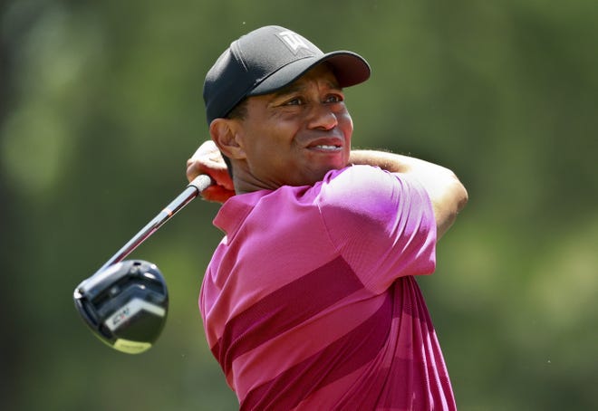 Tiger Woods watches his tee shot on the third hole during the first round of the Wells Fargo Championship golf tournament at Quail Hollow Club in Charlotte, N.C. on Thursday. [AP PHOTO/JASON E. MICZEK]