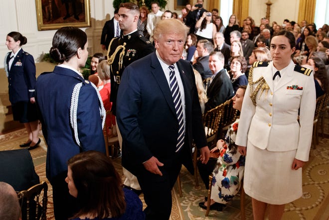 President Donald Trump walks from the East Room after presenting Mandy Manning, a teacher at the Newcomer Center at Joel E. Ferris High School in Spokane, Wash., with the National Teacher of the Year award at the White House in Washington, Wednesday, May 2, 2018. (AP Photo/Carolyn Kaster)
