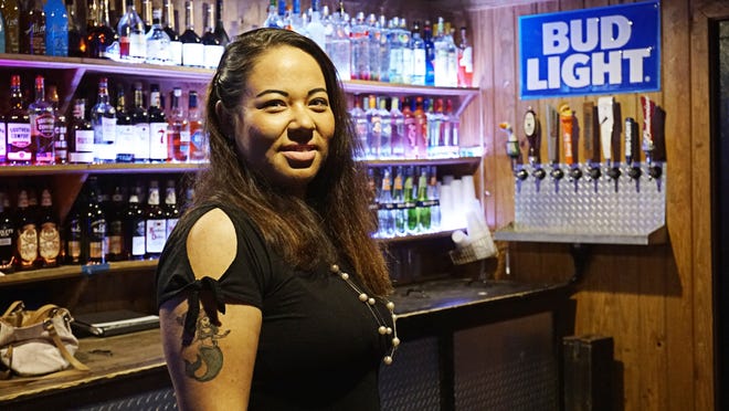 Dani Parham is one of the smiling faces behind the bar at Players on U.S. 98. [PHOTOS BY KRISTY LYNNE SMITH/THE NEWS HERALD]