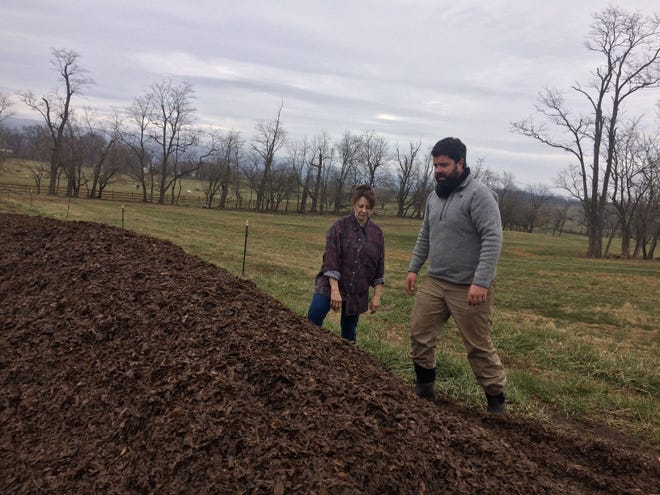 Sandy Lerner and farm manager Chris Damewood check out their mammoth compost operation at Ayrshire Farm in Upperville, Virginia. [ADRIAN HIGGINS/WASHINGTON POST]
