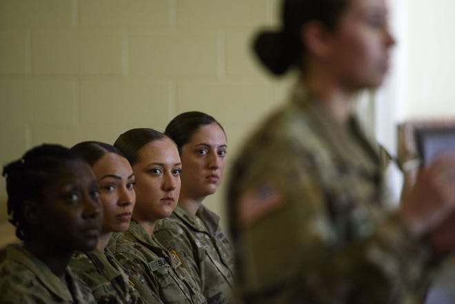1st Lt. Ciara Jackson, Sgt. Jasmyn Lujan, left to right, Pfc. Mary Slatten, and Spc. Mary Jones, listen to a presentation by 1st. Lt. Samantha Miller during a discussion held for veterans of the 3rd Battalion, 27th Field Artillery Regiment on May 4, 2018. The discussion was apart of several events for veterans of the regiment as they celebrated a 30 year anniversary. Females have only recently been allowed to serve in the unit. [Melissa Sue Gerrits/The Fayetteville Observer]
