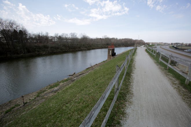 A view of the Tuscarawas river and Ohio & Lake Erie Towpath Trail looking north along state Route 21 in Massillon. The city is looking into developing multiple sections of the river within the city limits to improve recreational use and aquatic habitats. (IndeOnline.com / Kevin Whitlock)