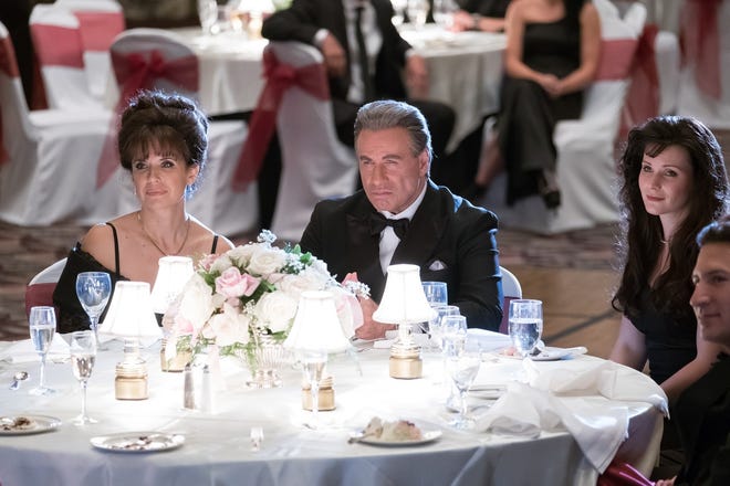John Travolta, center, plays the late crime boss John Gotti, and Kelly Preston, left, plays Gotti’s wife, Victori, in "Gotti," which will premiere at Cannes on May 15. [Vertical Entertainment]