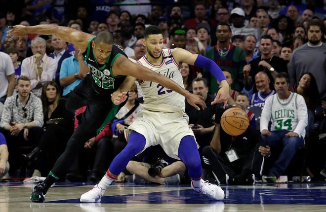Boston's Al Horford, left, and Philadelphia 76ers' Ben Simmons chase the ball during the second half of Game 3 of their second-round playoff series Saturday in Philadelphia.\