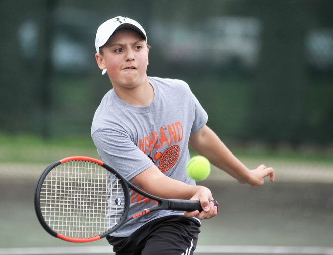 Ryan Frazee returns a shot during a doubles match at the Ohio Cardinal Conference tournament Saturday in Wooster. Frazee and Andrew Furness won the second doubles title to help the Arrows finish second behind Lexington.