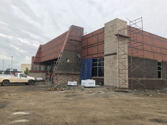 A building under construction Friday in the 5400 block of Phoenix Avenue is set to house Uncork'd, Gusano's Chicago-Style Pizzeria and a Baskin-Robbins. Construction is set to be completed for a July opening of the businesses. [JOHN LOVETT/TIMES RECORD]