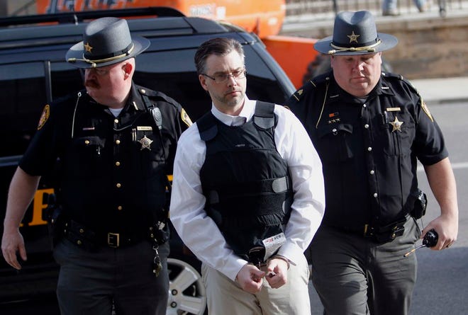 Shawn Grate, center, is escorted into Ashland County Courthouse on April 23 by Ashland County Sheriff's Deputy Shannon Mahoney, left, and Sgt. Brian Martin for his aggravated murder trial. Grate was found guilty on Monday of all 8 charges he was facing, including 4 counts of aggravated murder, three counts of kidnapping and an aggravated robbery charge. Grate faces the death penalty.(Tom E. Puskar/The Times Gazette)